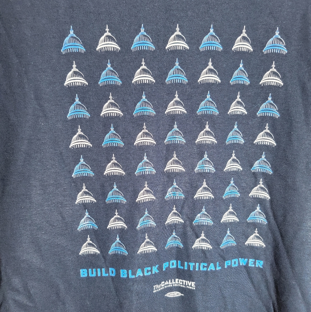 Build Black Political Power size small unisex t-shirt. Dark marks are shadows.